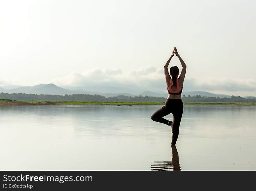 Yoga women lifestyle exercise and pose for healthy life. Young girl or people pose balance body vital zen and meditation for workout sunrise morning nature background. Health care Concept