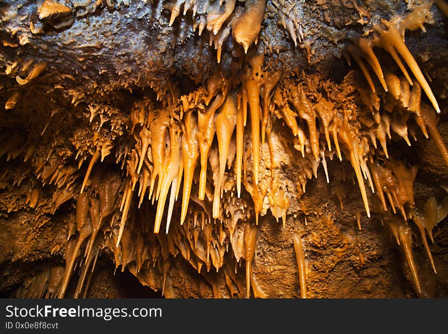 Underground vaults of the cave covered with stalactites. Underground vaults of the cave covered with stalactites.