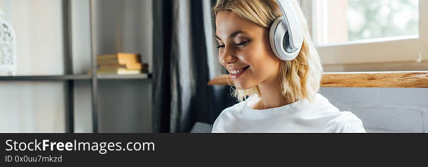 Orientation of smiling woman listening music