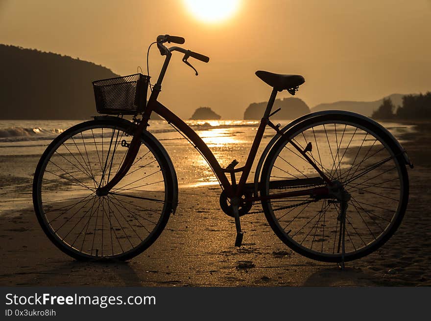 silhouette of bicycle at beach, bicycles on beach sunset or sunrise