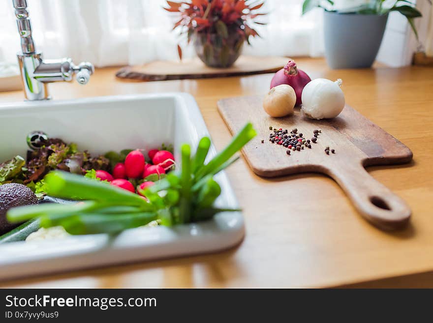 Still Life In The Sink And Onions