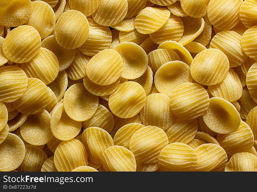 Full background of dry uncooked pasta. close-up