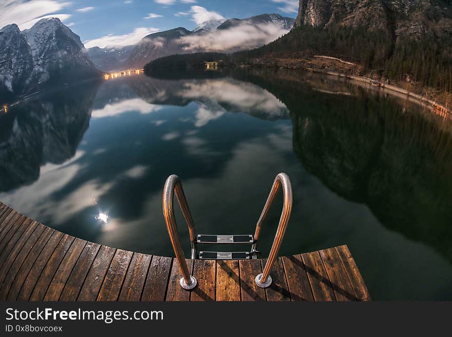 Pier in Obertraun Lake Hallstatt at night in Salzkammergut, Austria in winter