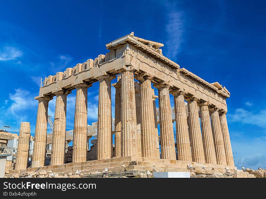 Parthenon temple on the Acropolis in a summer day in Athens, Greece. Parthenon temple on the Acropolis in a summer day in Athens, Greece