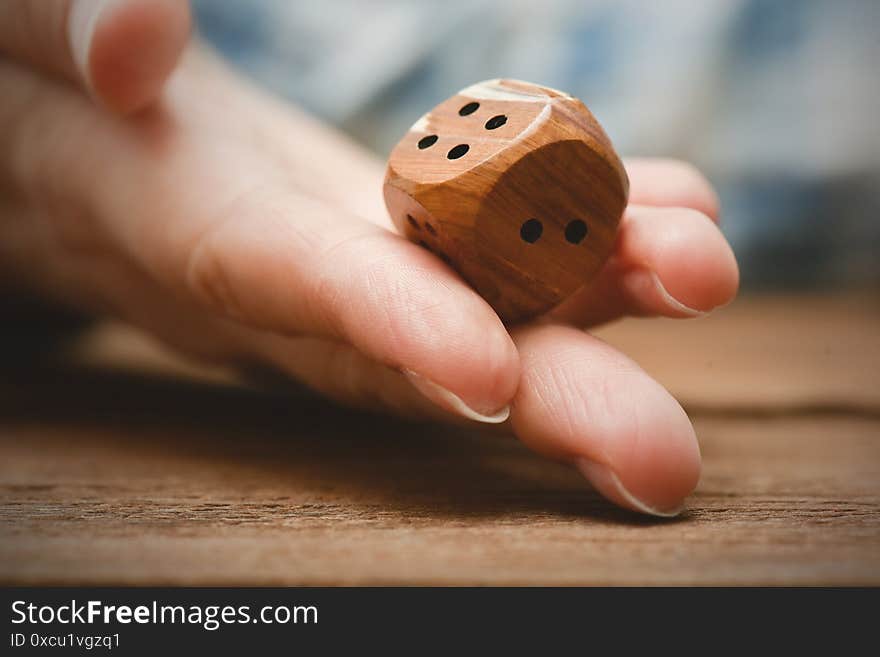 The dice in female hand close up