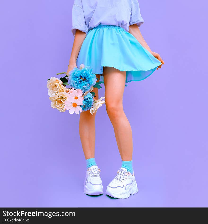 Fresh flowers Summer look. Girl in short playful skirt. Bloom romantic vibes. Blue monochrome color trends.