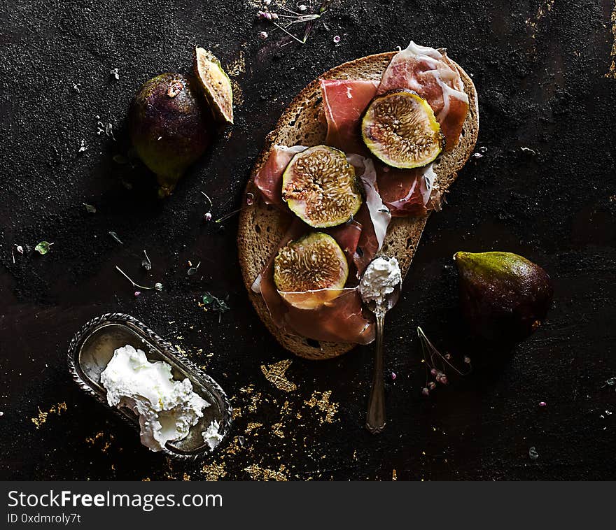 Tasty summer break with rye bread,fig and parma ham top view. Tasty summer break with rye bread,fig and parma ham top view