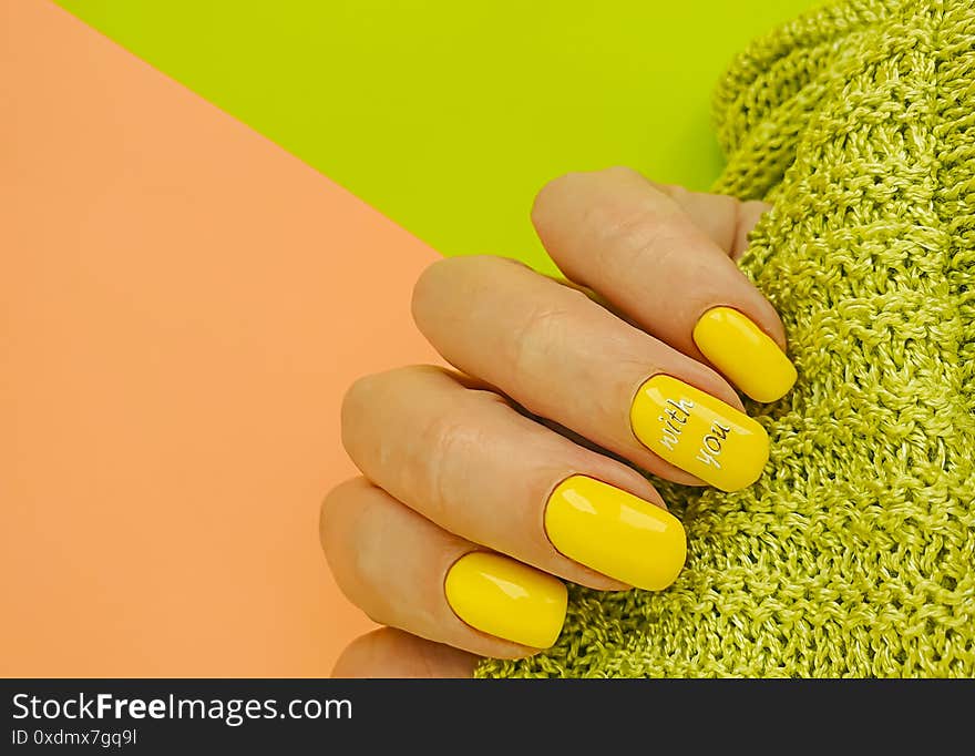 Female hand beautiful, manicure nail  color  fashion sweater knitted