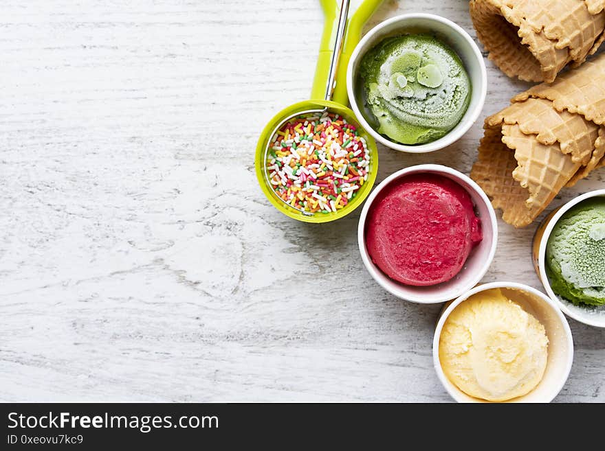 Ice cream flavors in cup and topping, sweet and dessert food concept