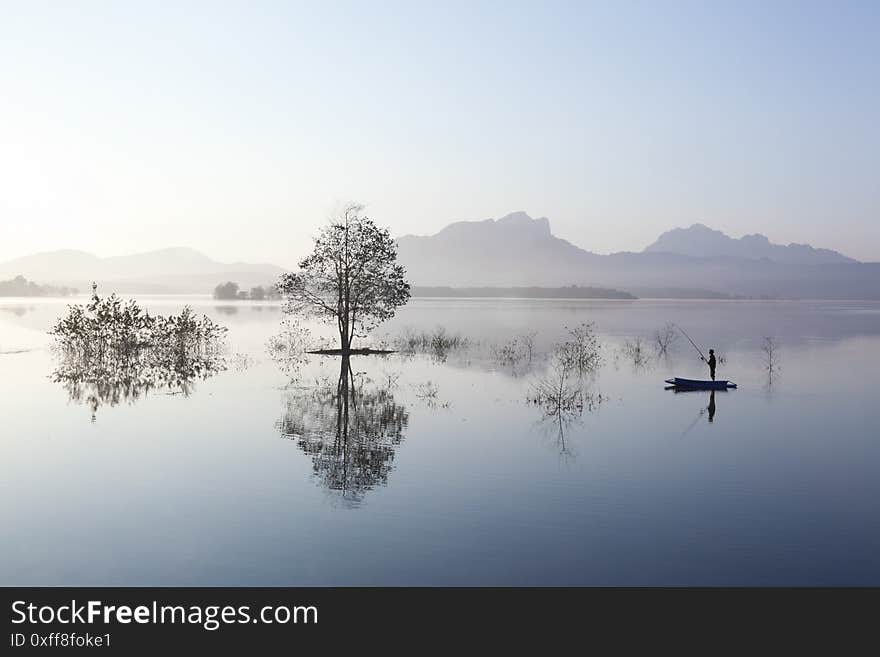 Fisherman Fishing In Big Lake ,thailand