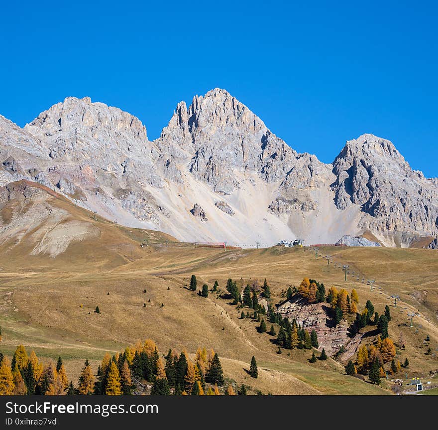 Autumn alpine mountain lake near San Pellegrino Pass, Trentino, Dolomites Alps, Italy