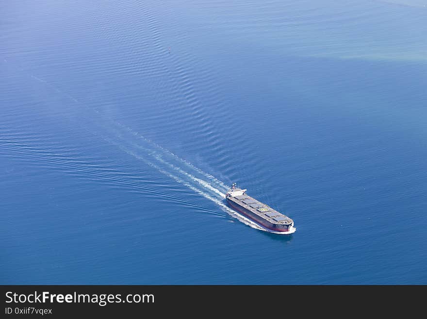 Aerial view of a container ship embarking on Melbourne Port. Aerial view of a container ship embarking on Melbourne Port.