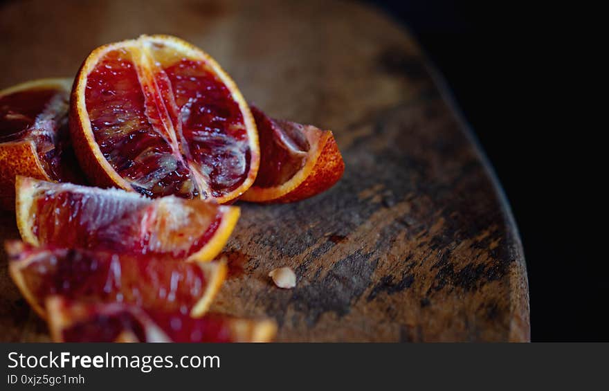 Slices of red oranges on a wooden Board