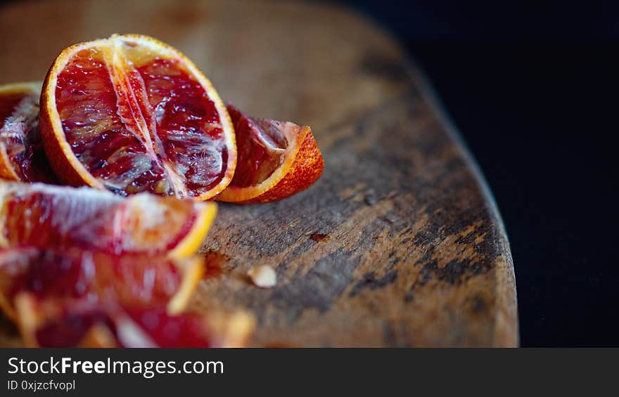 Slices of red oranges on wooden Board