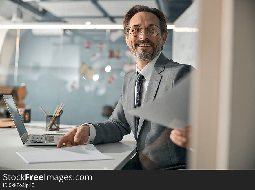 Businessman are exchanging document or contract in the office