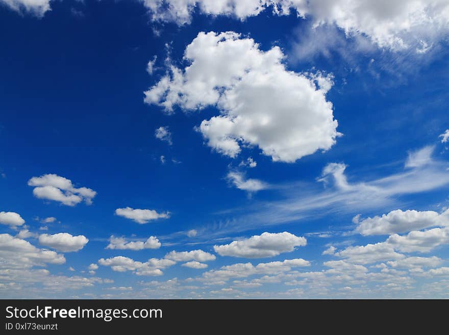 White clouds of different shapes, beautiful summer blue sky with clouds. White clouds of different shapes, beautiful summer blue sky with clouds
