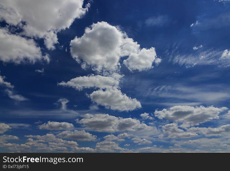 White clouds of different shapes, beautiful summer blue sky with clouds. White clouds of different shapes, beautiful summer blue sky with clouds