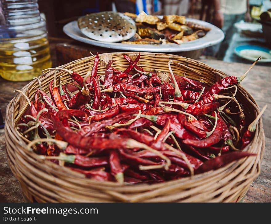 Bangladesh street food - dried red chili pepper in bamboo basket, Asian food ingredient at Dhaka market. Bangladesh street food - dried red chili pepper in bamboo basket, Asian food ingredient at Dhaka market