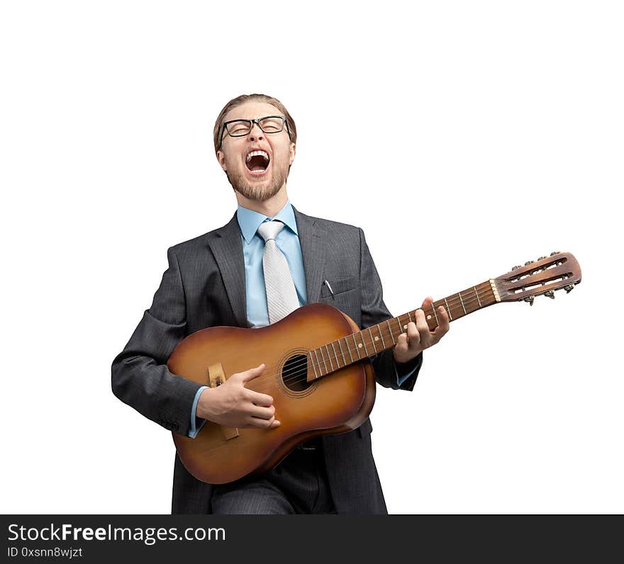 Portrait one man businessman or office-worker playing on musical instrument - guitar and  loud sing, on white background, isolated. Portrait one man businessman or office-worker playing on musical instrument - guitar and  loud sing, on white background, isolated