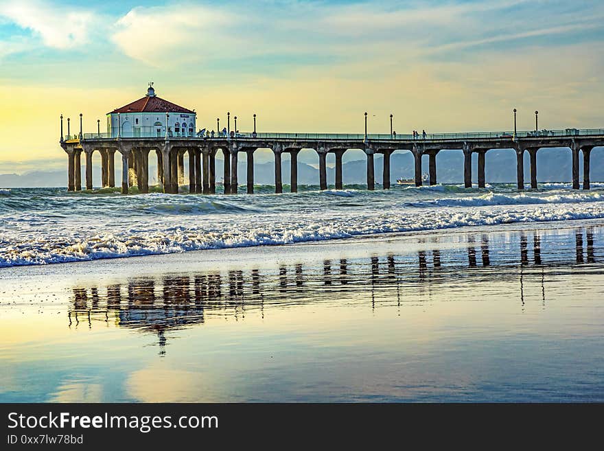 Scenic pier at Manhattan Beach near Los Angeles in sunset mood