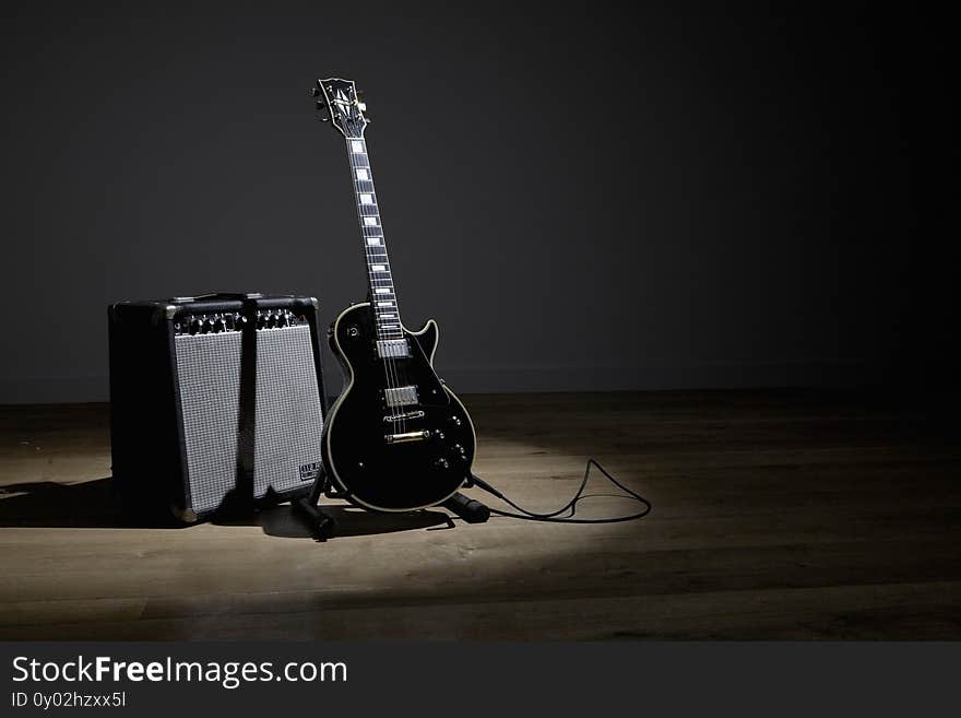 Photo of Electric guitar and amplifier on stage