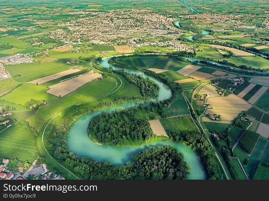 Piave river seen from above with trees and green lagoon