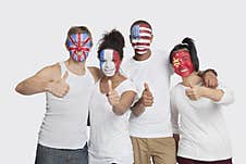 Portrait Of Happy Multi-ethnic Group Of Friends With Various National Flags Painted On Their Faces Gesturing Thumbs Up Against Whi Stock Images