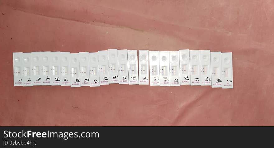 Corona virus Covid19 rapid antigen testing kit under observation after swab collection and test on the table numbered arranged in line.