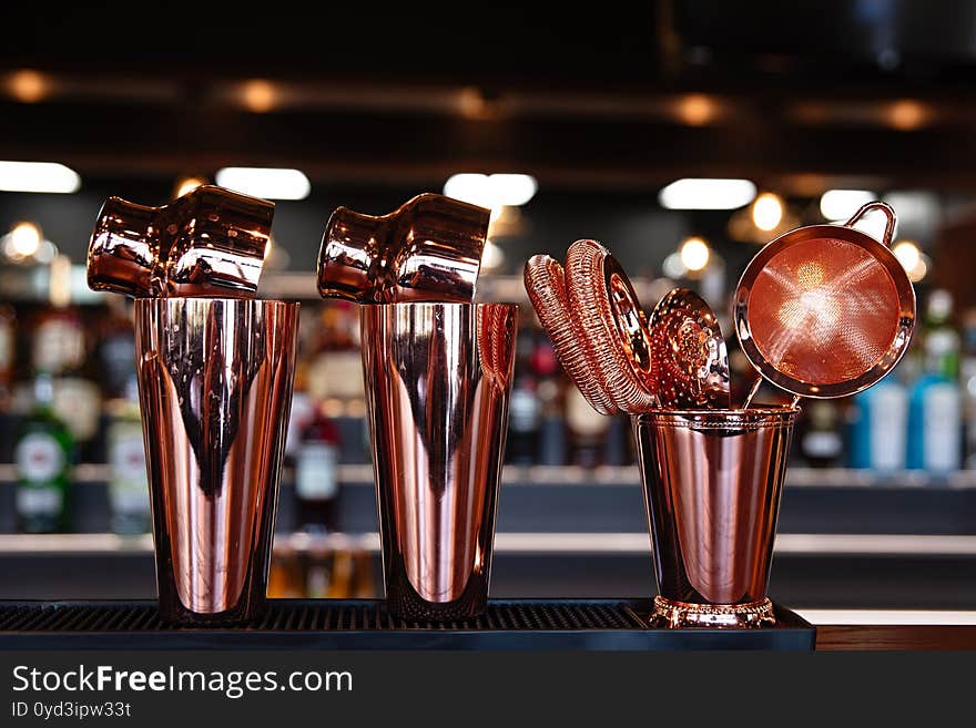 Dishes Made Of Red Metal Are On The Bar, Dishes For The Preparation Of Cocktail, Shiny Metal