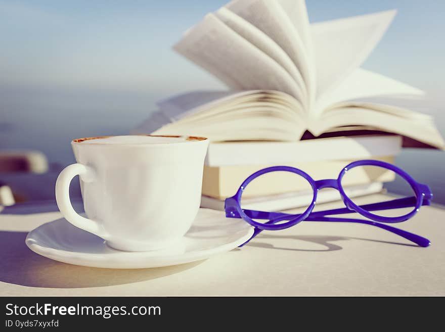 Coffee Cup And Books Outdoors