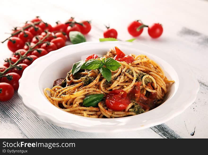 Plate of delicious spaghetti Bolognaise or Bolognese with savory minced beef and tomato sauce garnished with parmesan cheese