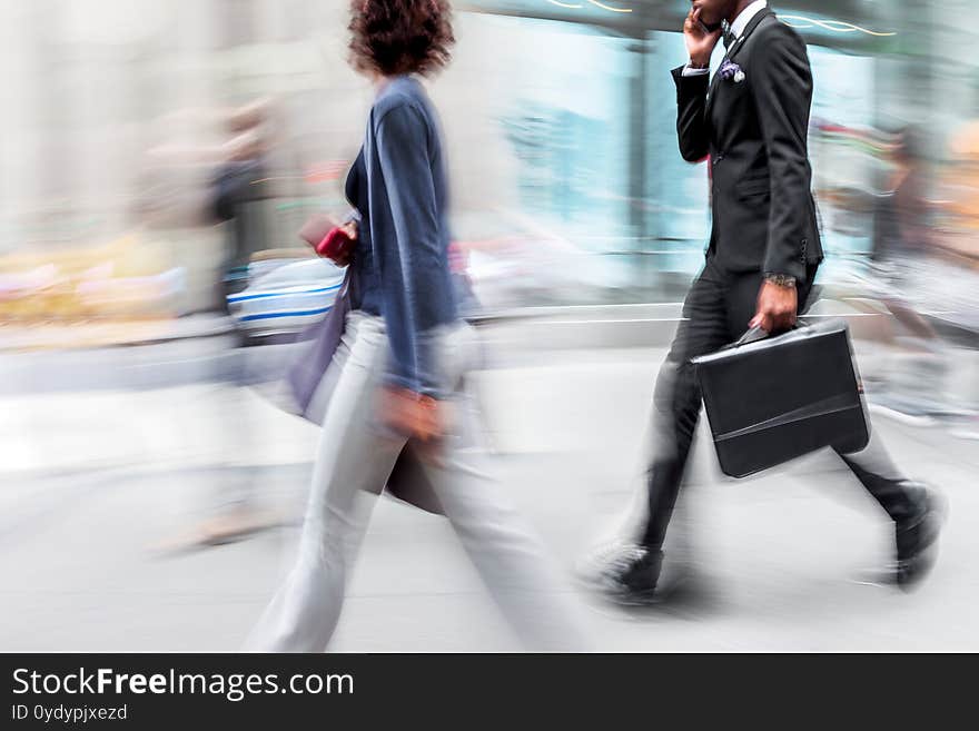 Abstract image of business people in the street and modern style with a blurred background. Abstract image of business people in the street and modern style with a blurred background