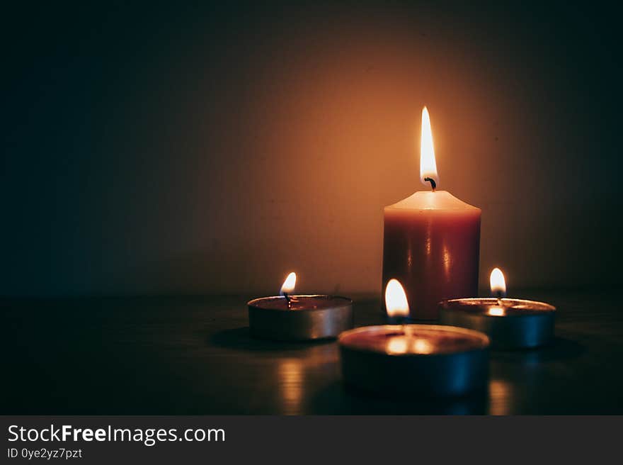 Burning Candles With Dark Background