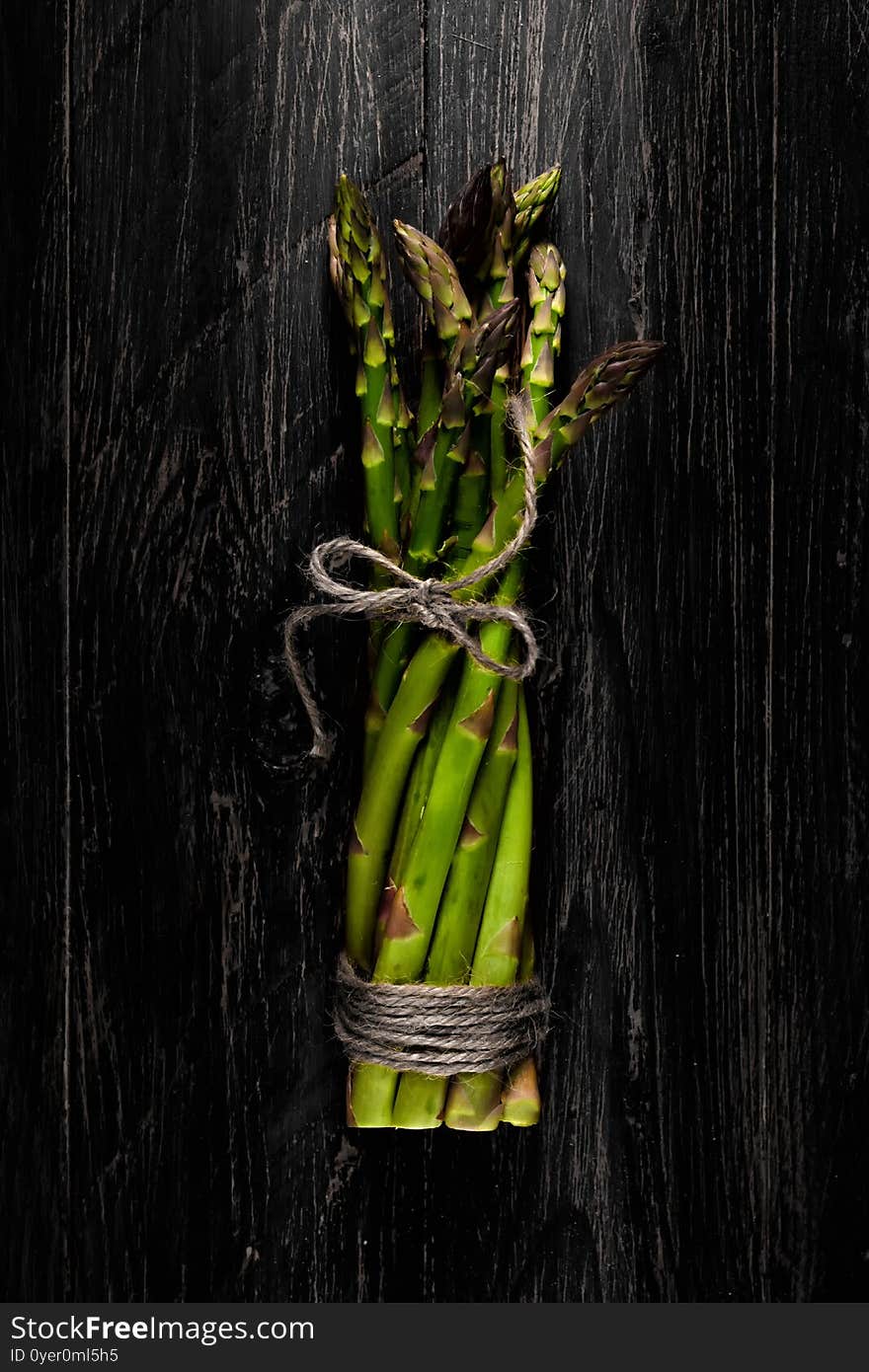 Green asparagus  seen from above over a wooden table