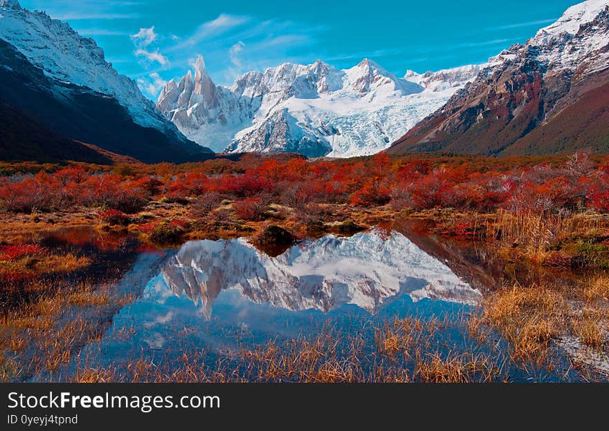 Light White Snow On Mountain With White Cloud And Blue Sky And Fantastic Nature