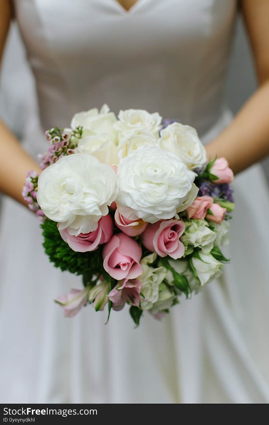 Close up of a wedding bouquet hand held by a wedding bride