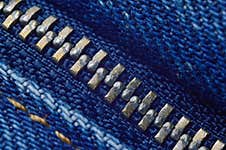 Metal Zipper On Blue Jeans. Stock Photography