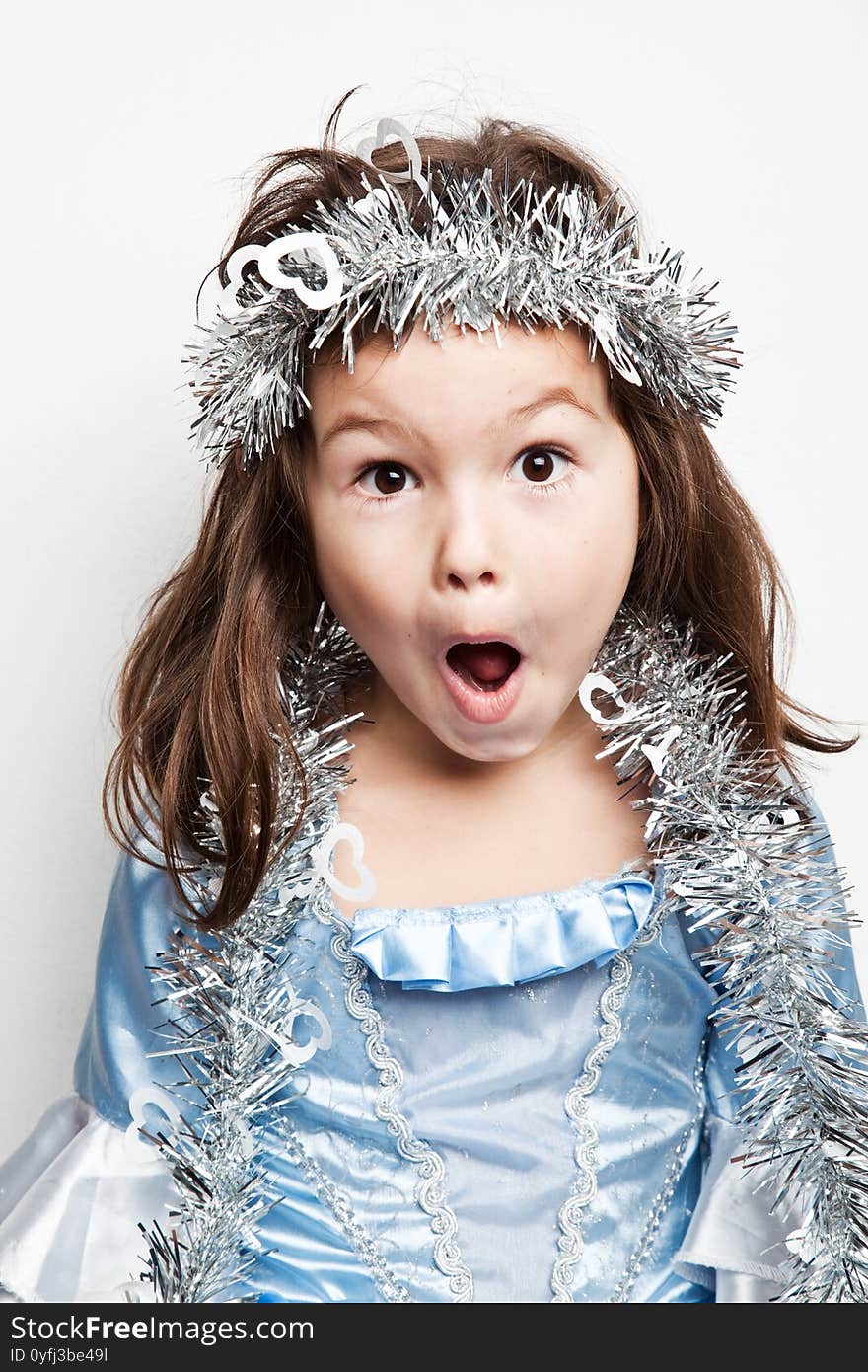 Portrait Of A Little Girl In A Snowflake Costume.