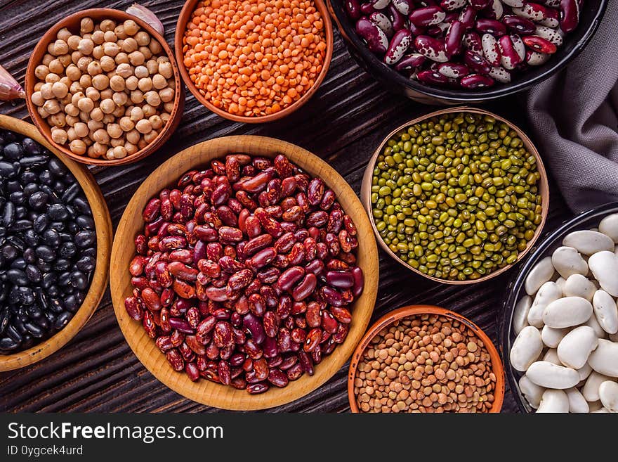 Fresh organic natural beans on wooden rustic background