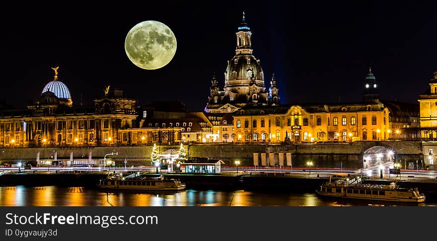 Dresden skyline with moon at night