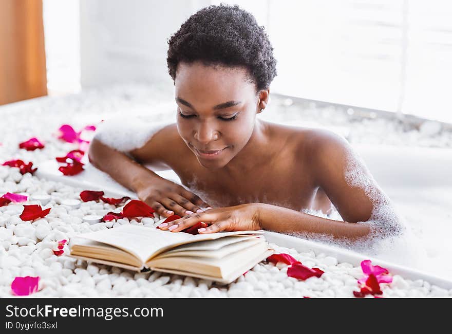 Free Time And Rest. African American Girl In Foam In Bathroom Reads Book