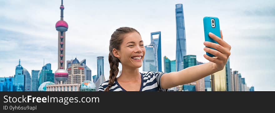 China Travel Asian Girl Tourist Taking Phone Selfie Photo On The Bund In Shanghai City Vacation. Happy Chinese Young