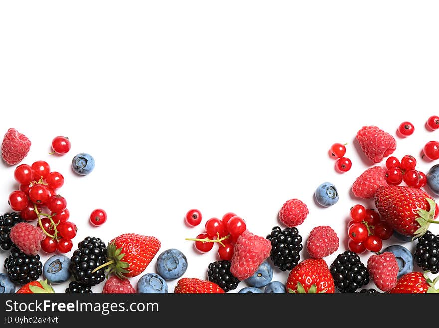 Mix of fresh berries on white background, flat lay