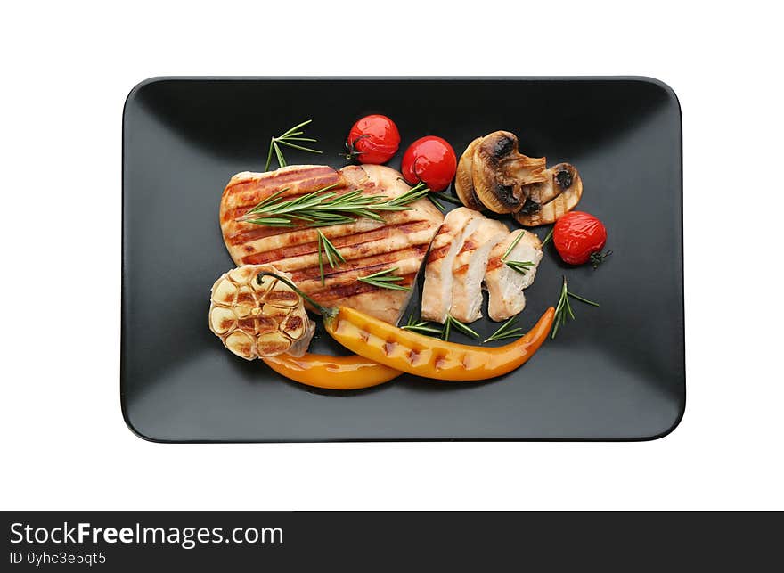 Tasty grilled chicken fillet with rosemary and vegetables isolated on white, top view