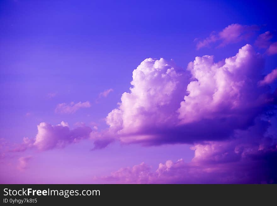 Large heavy clouds slowly float across the blue beautiful sky. Stunning landscape and view. Sky clouds background.