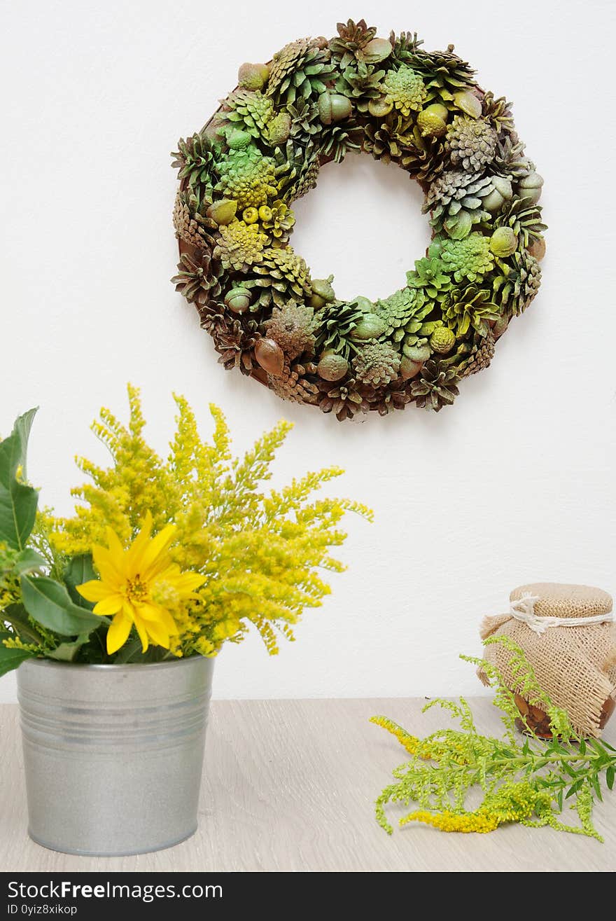 Autumn still life with wreath and flower