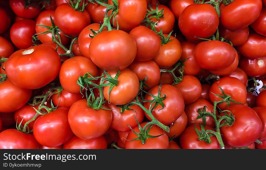 Fresh and tasty garden tomato on a local market and grocery store. Fresh and tasty garden tomato on a local market and grocery store.