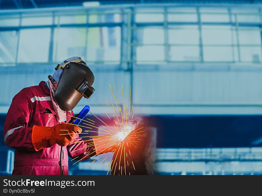 Industrial welding process worker at factory close up with spark light. Industrial welding process worker at factory close up with spark light