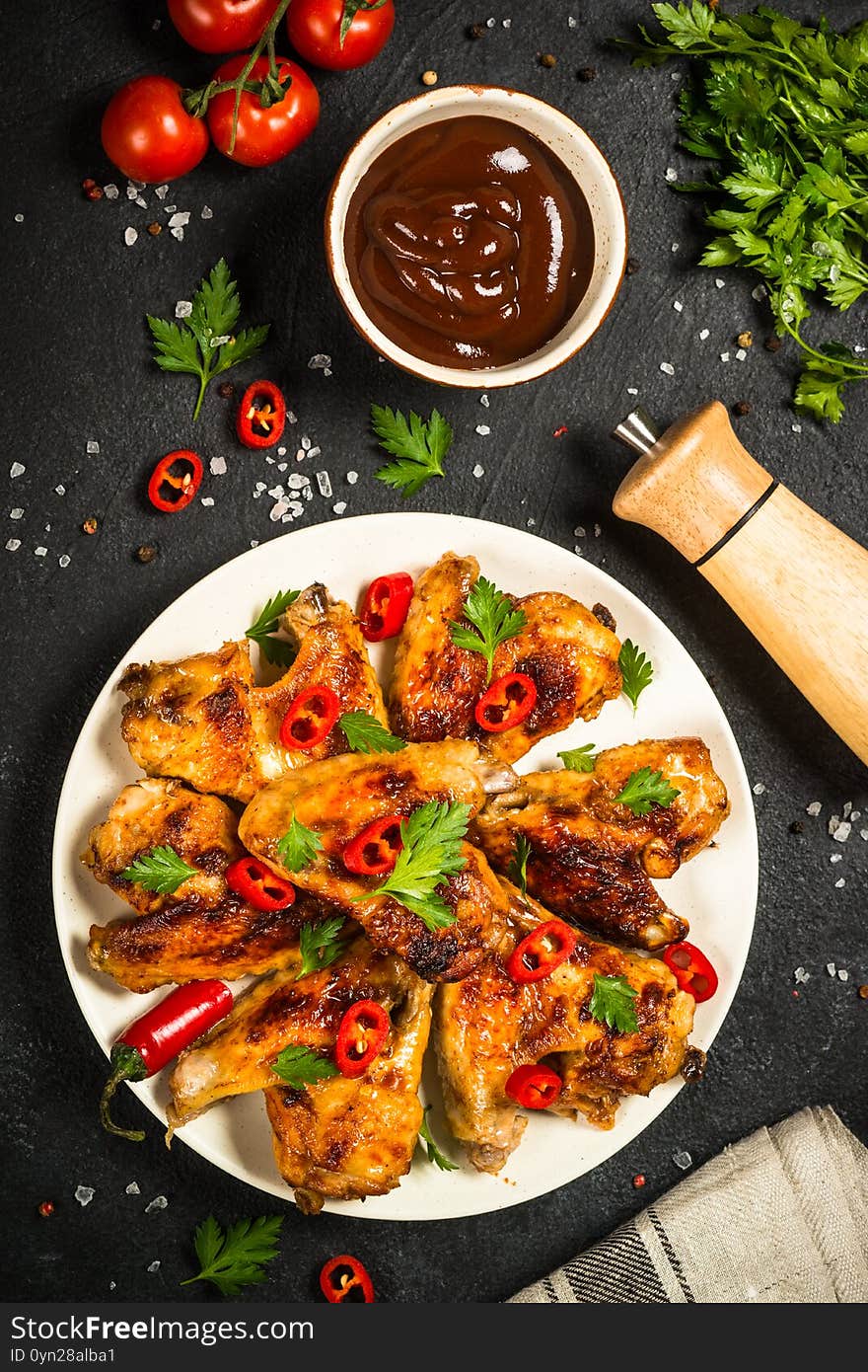 Chicken wings with bbq sauce. Grilled meat, barbeque dish american food. Top view with copy space. Chicken wings with bbq sauce. Grilled meat, barbeque dish american food. Top view with copy space.