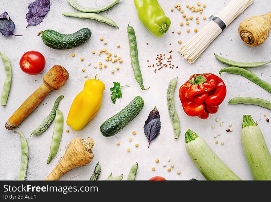 Tasty appetizing farm organic vegetables with healthy grocery on light background. Healthy eating concept. Top View. Tasty appetizing farm organic vegetables with healthy grocery on light background. Healthy eating concept. Top View